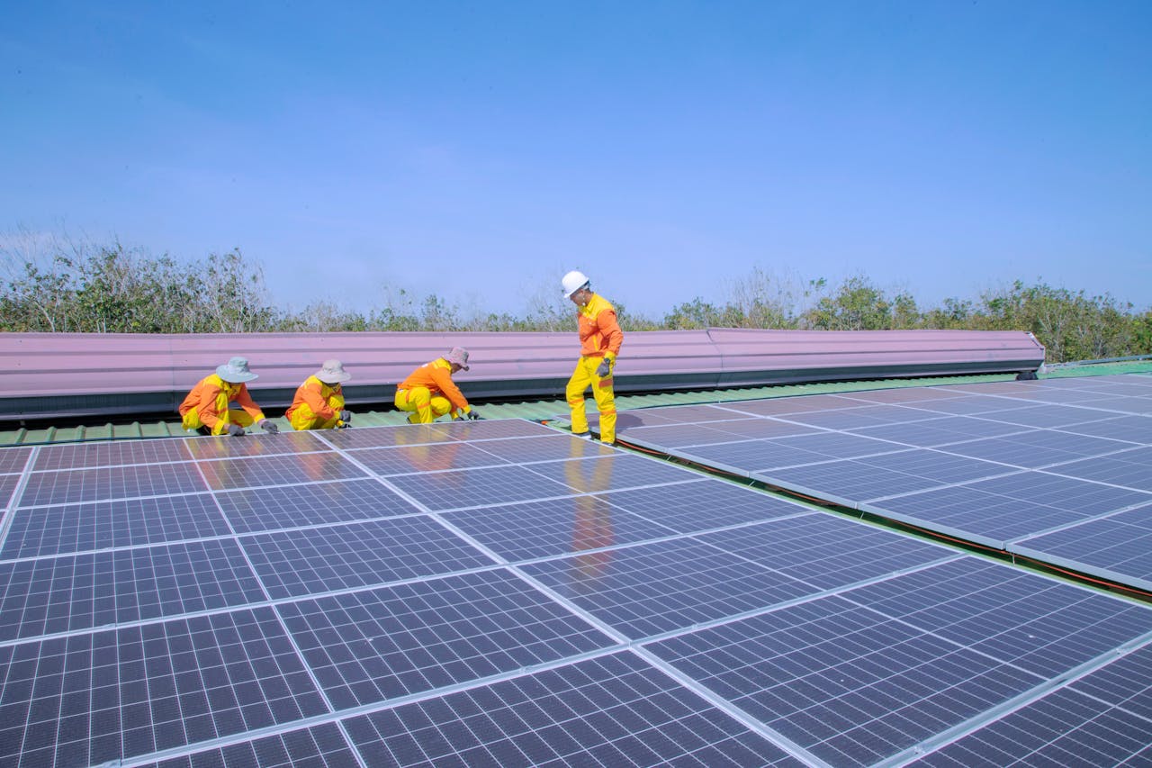 The Art of Drawing Readers In: Your attractive post title goes here Workers install solar panels on a rooftop, promoting renewable energy and sustainability.
